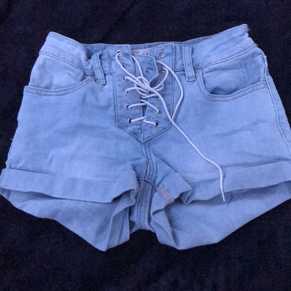 Light blue jeans with strings